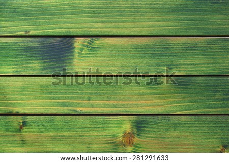 Wood texture, old green painted wood panel background.