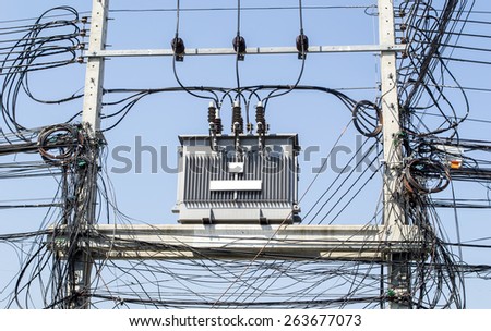 Transformer on Electricity post, high power station. High voltage ,cable wire tattered