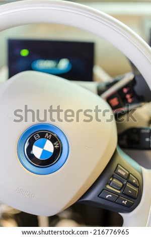 MUNICH, GERMANY - AUGUST 8, 2014: White design interior of environmentally friendly full-time electric car BMW i3. Vertical close-up photo with small DOF.