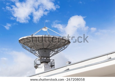 Military radio locator station with parabolic radar antenna dish is part of missile defense antimissile system