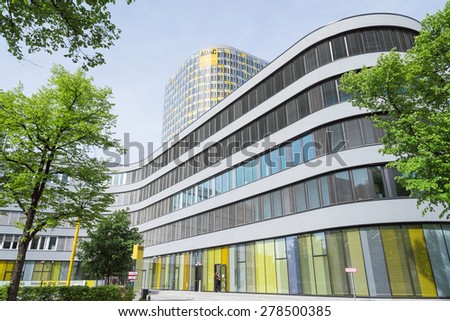 Munich, Germany - May 12, 2015: The new ADAC Headquarters accommodates 2,400 employees who were previously spread across six different locations. The 18-story office tower rises above a 5-story base.