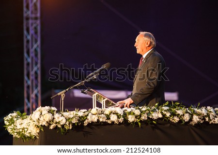 RIGA, LATVIA AUGUST 23, 2014: President of Latvia Andris Berzins giving a speech in front of the monument of Freedom at the \