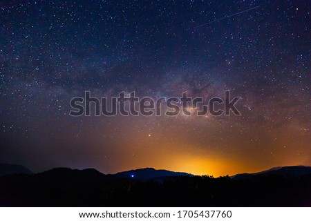 Amazing galaxy with the milky way and golden bright light before sunrise, The starry in the night sky are visible from earth