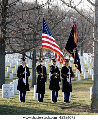 WASHINGTON - JANUARY 14: Military Color Guard with flags at full honors funeral at Arlington Cemetery on January 14, 2010 in Arlington, VA.