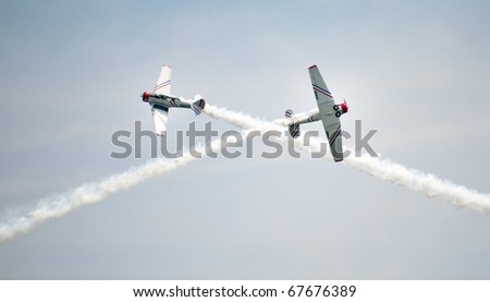 OCEAN CITY, MD - JUNE 5: Aerobatic demonstration with two planes crossing paths at the Ocean City Air Show on June 5, 2010 in Ocean City, Maryland.