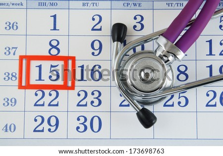 Regular medical examination concept, stethoscope on calendar