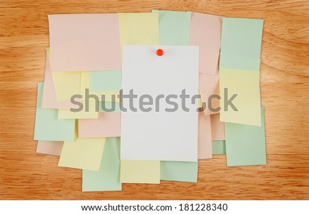 A lot of note papers on wooden house wall