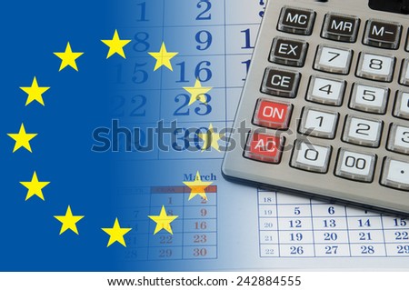 Calculator on calendar background with flag europe union