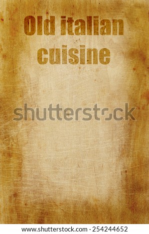 Old grunge wooden kitchen cutting board as background with words old italian cuisine