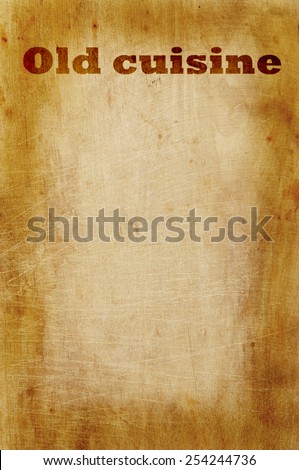 Old grunge wooden kitchen cutting board as background with words old cuisine
