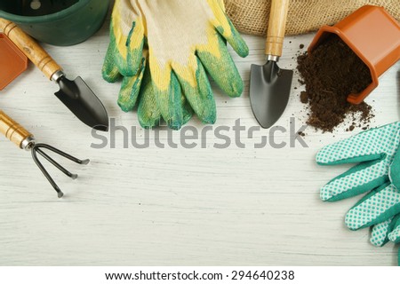 Gardening concept, gardening tools on old white table with room for text
