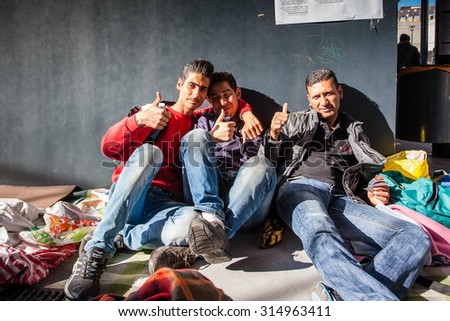 BUDAPEST - SEPTEMBER 7: war refugees waiting for train at Keleti Railway Station on 7 September 2015 in Budapest, Hungary. Refugees are arriving constantly to Hungary on the way to Germany.