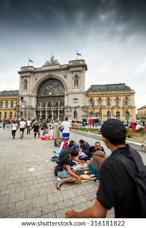 BUDAPEST - SEPTEMBER 4 : War refugees at the Keleti Railway Station on 4 September 2015 in Budapest, Hungary. Refugees are arriving constantly to Hungary on the way to Germany.