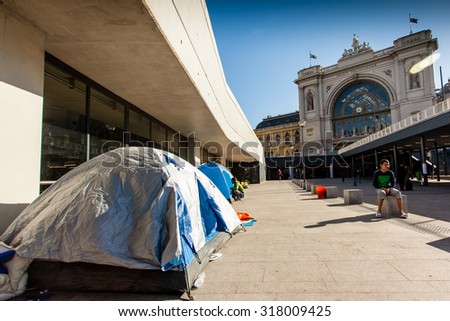 BUDAPEST - SEPTEMBER 7:  war refugees at Keleti Railway Station on 7 September 2015 in Budapest, Hungary. Refugees are arriving constantly to Hungary on the way to Germany.