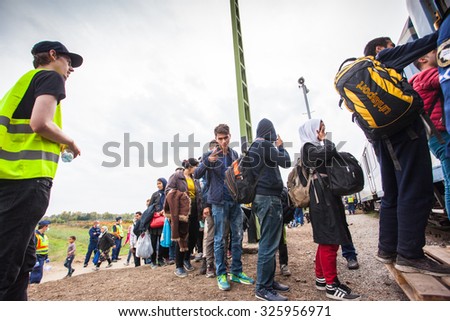 GYEKENYES- OCTOBER 6 : War refugees at the Gyekenyes Zakany Railway Station on 6 October 2015 in Gyekenyes, Hungary. Refugees are arriving constantly to Hungary on the way to Germany.