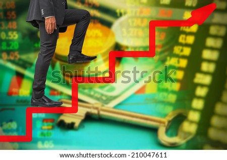 businessman step up to success on line graph on money concept background