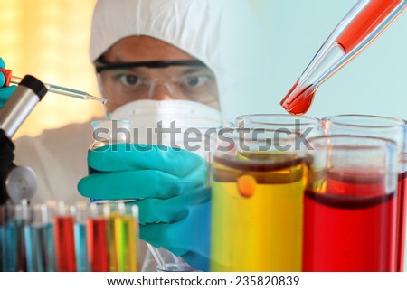 Pipette adding red fluid to test tubes,laboratory concept