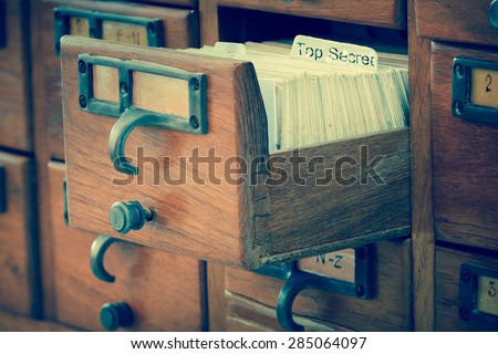 top secret file in wooden drawer