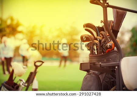 closeup of golf club in bag on golfer background