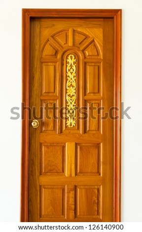 Carved wooden door and Golden Thai design craft