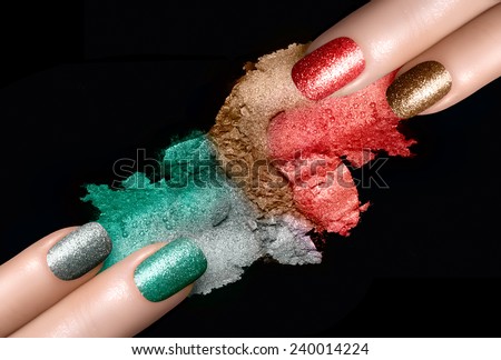 Close Up of Women Hands with Painted Nails and Coordinating Mineral Eye Shadows Swatches in Festive Colors on Black Background