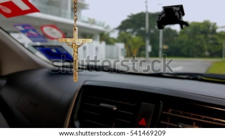 Similar – Image, Stock Photo A rosary hangs from an open Christian prayer book with the Our Father