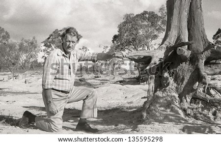 TOOWOOMBA, AUSTRALIA circa 1983: Professor Roberts shows the loss of top soil on a badly eroded farm circa 1983 near Toowoomba, Australia. Soil erosion continues to cost farmers millions of dollars.