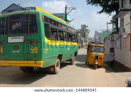 KALAKAD, TAMIL NADU, INDIA, circa 2009: Streets crowded with a dominating bus, circa 2009 in the village of Kalakad, Tamil Nadu, India. India\'s population is more than 1.2 billion and growing.