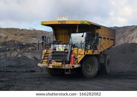 WESTPORT, NEW ZEALAND, JULY 12, 2013: A 70 ton truck waits for coal at Stockton open cast coal mine on July 12, 2013 near Westport, New Zealand. Stockton is the country\'s largest open cast coal mine.
