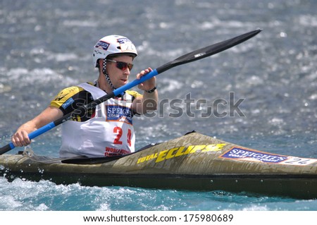 SOUTH ISLAND, NEW ZEALAND, FEBRUARY 12, 2011: Sam Evans competes in the kayaking leg of the 2011 Coast to Coast triathlon, New Zealand