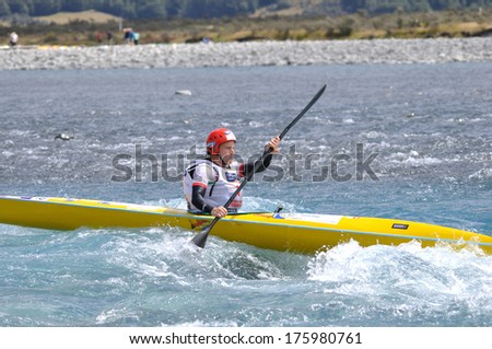 SOUTH ISLAND, NEW ZEALAND, FEBRUARY 12, 2011: Unidentified man competes in the kayaking leg of the 2011 Coast to Coast triathlon, New Zealand