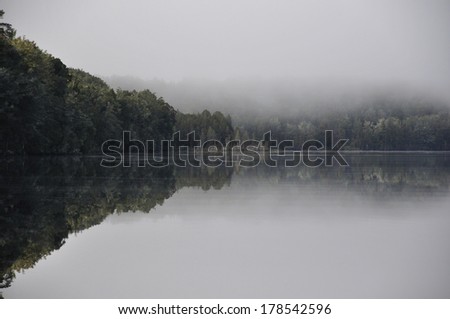 early morning mist on Lake Haupiri, a small lake near the Southern Alps, West Coast, South Island, New Zealand.