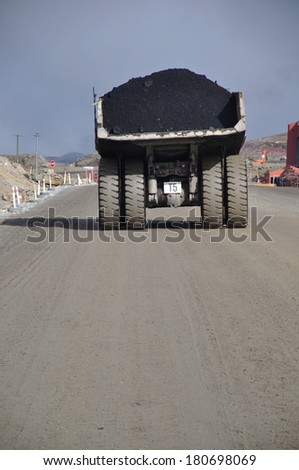 Huge truck moves high grade coal at an open cast mine in New Zealand