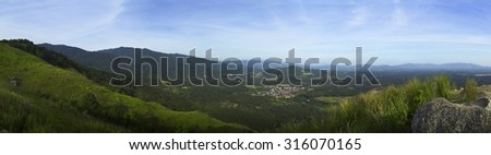 panorama view of hill with mountain landscape background