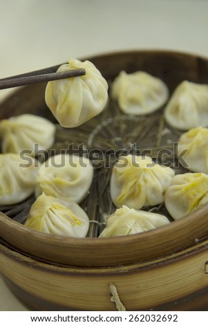 Traditional Chinese soup dumpling - Xiao Long Bao, which is a popular Chinese dim sum steamed on a bamboo steamers.