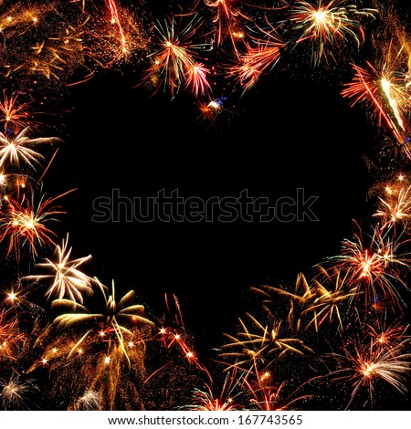 fireworks frame on black background in heart shape