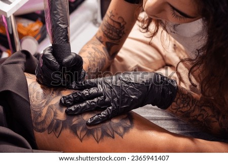 Similar – Image, Stock Photo Anonymous crop tattooist working with client in salon