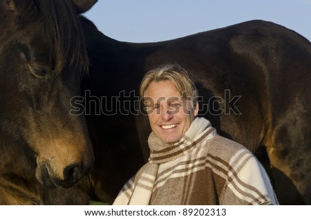 Handsome man with horse
