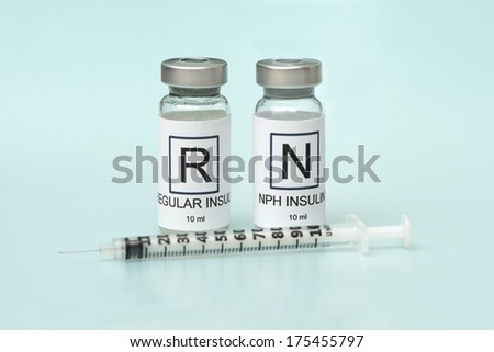 Regular and NPH insulin with insulin syringe on light blue background.