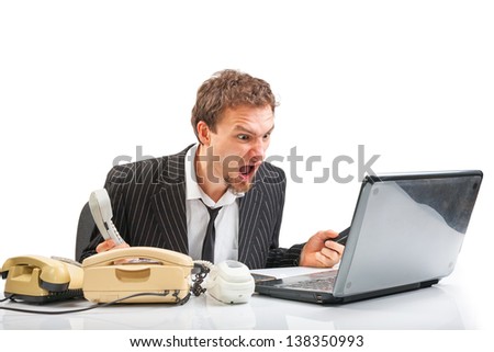 Businessman in a state of emotional distress cries looking at laptop isolated on white background