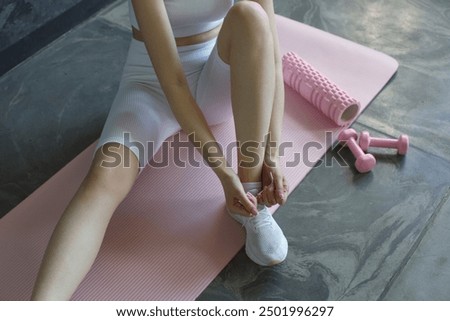 Similar – Image, Stock Photo Unrecognizable sportswoman exercising with elastic band at home