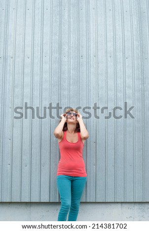 Portrait of beautiful girl with stylish looking up in sunglasses