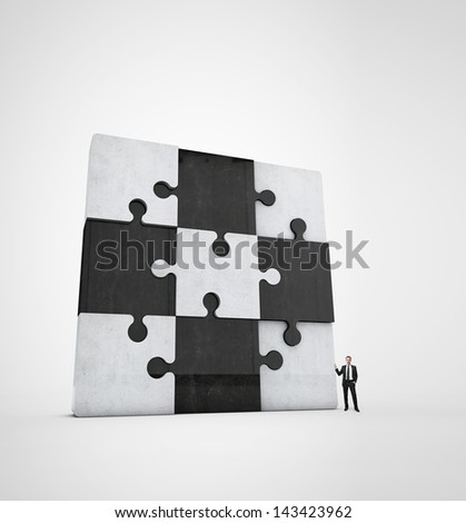 businessman near jigsaw puzzle