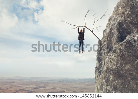 Businessman climbs a mountain