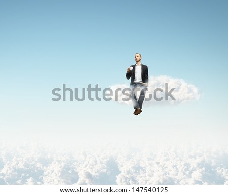 man sitting on a cloud with cup of coffee