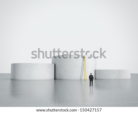man looking at empty podium with ladder