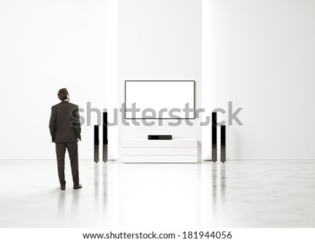 Businessman watching home cinema