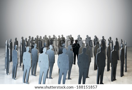 business man standing among people silhouettes