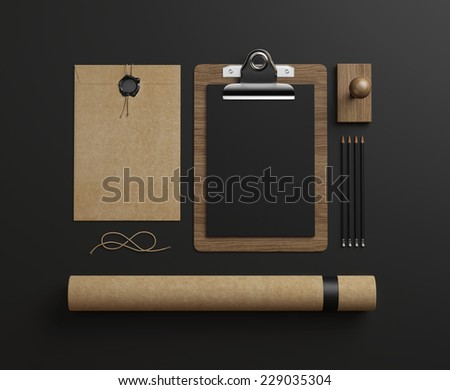 Set of stationery elements on black paper background