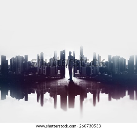 Double exposure concept with businessman and city